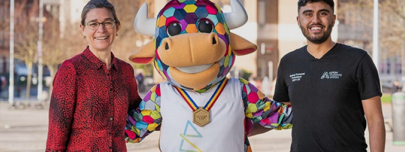 Aston student with mascot for Birmingham Commonwealth Games