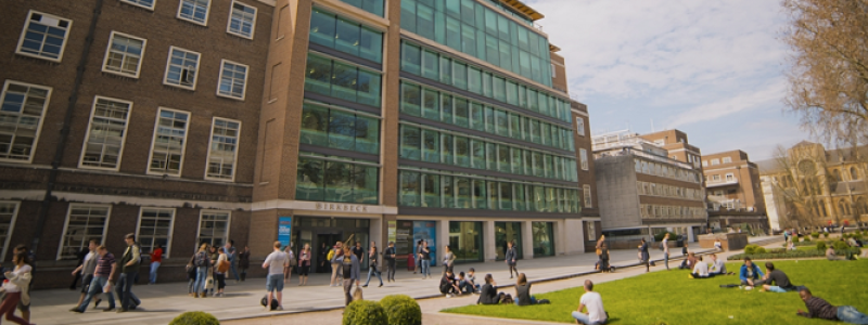Birkbeck campus building exterior with students sitting outside