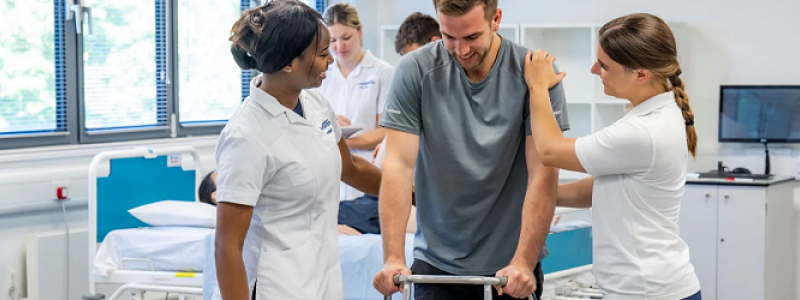 Southampton Nursing students with patient using a walker